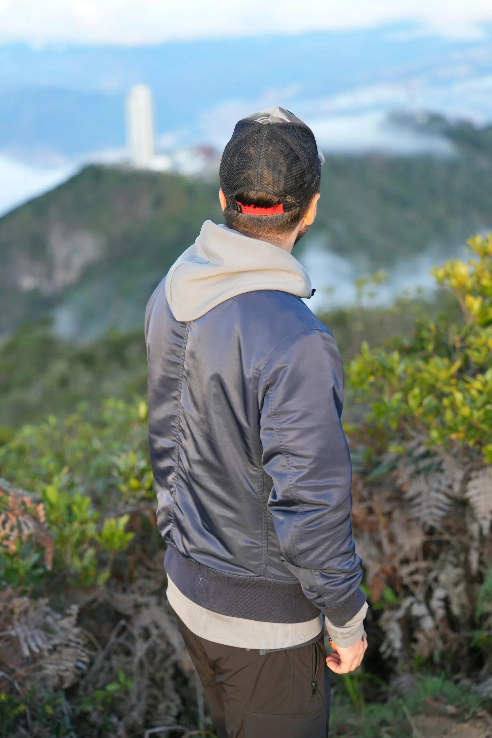 Adventure Travel: Thrilling Experiences for Adrenaline Seekers 1 a man standing on top of a lush green hillside